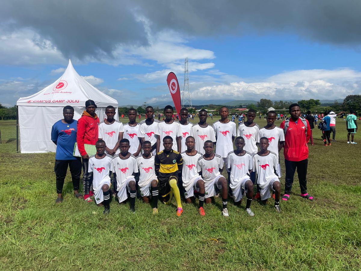 Satino Football Academy players and coaches together at a tournament